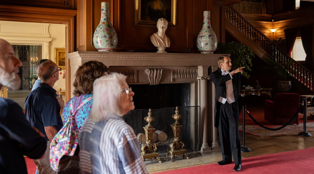 A costumed guide leads the Tales of the Titanic tour, in Mills Mansion at Staatsburgh State Historic Site, Staatsburg, photo by Pierce Johnston, courtesy of the NYS Office of Parks, Recreation and Historic Preservation